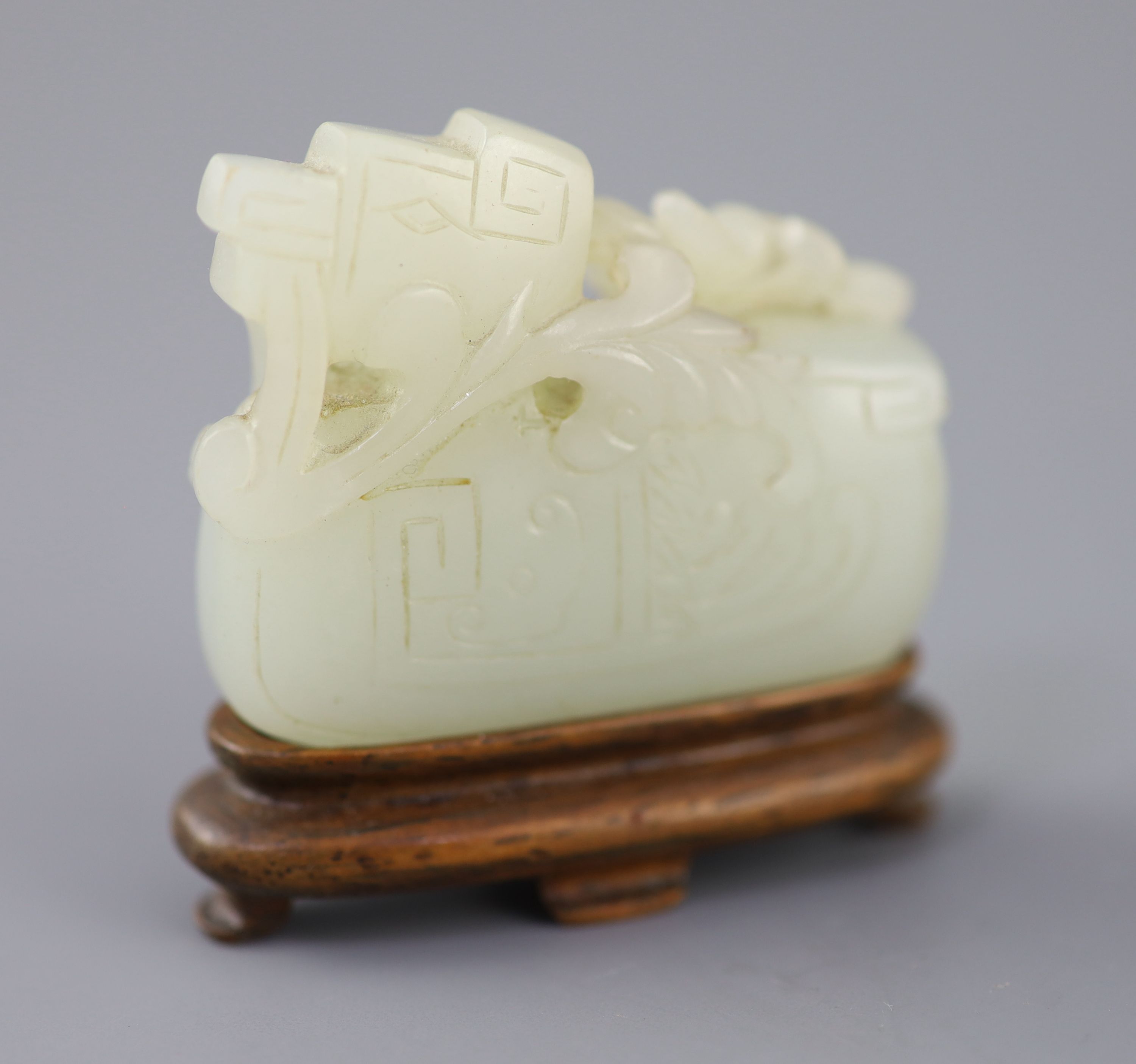 A Chinese archaistic pale celadon jade mandarin duck carving, 19th century, 5cm excluding wood stand